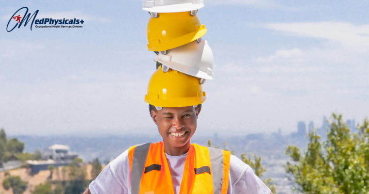 woman wearing stacked construction helmets